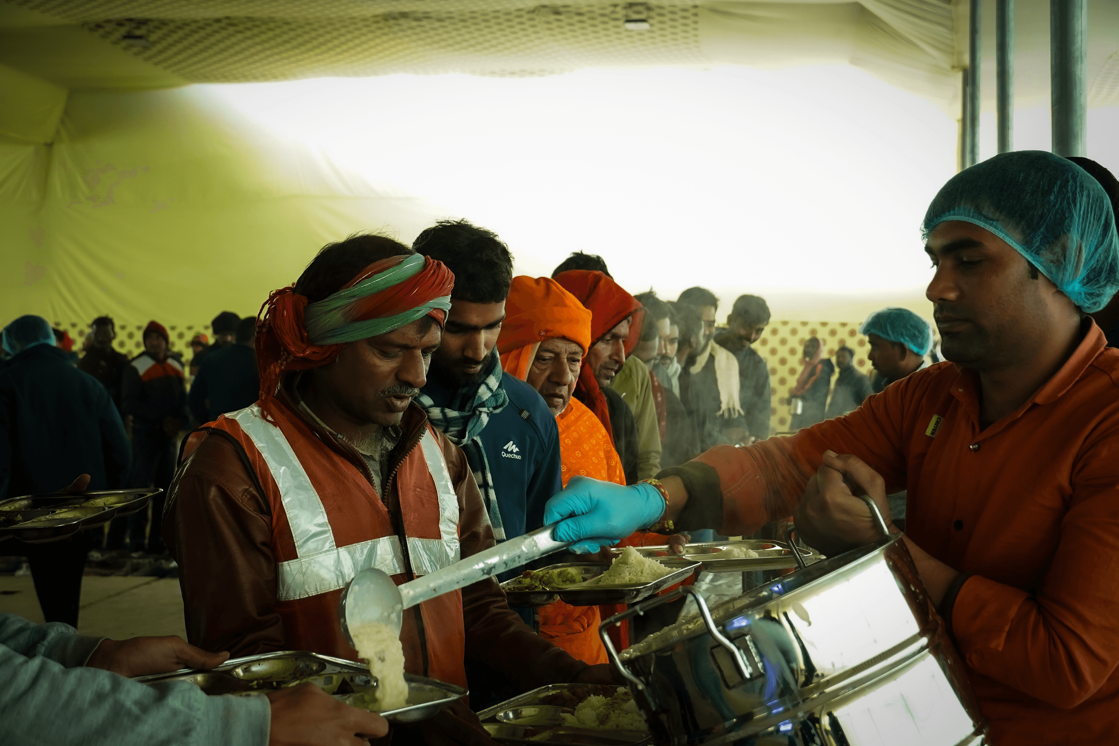 Devotees serving food as part of annadaan
